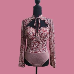 Pink floral long sleeve body suit.